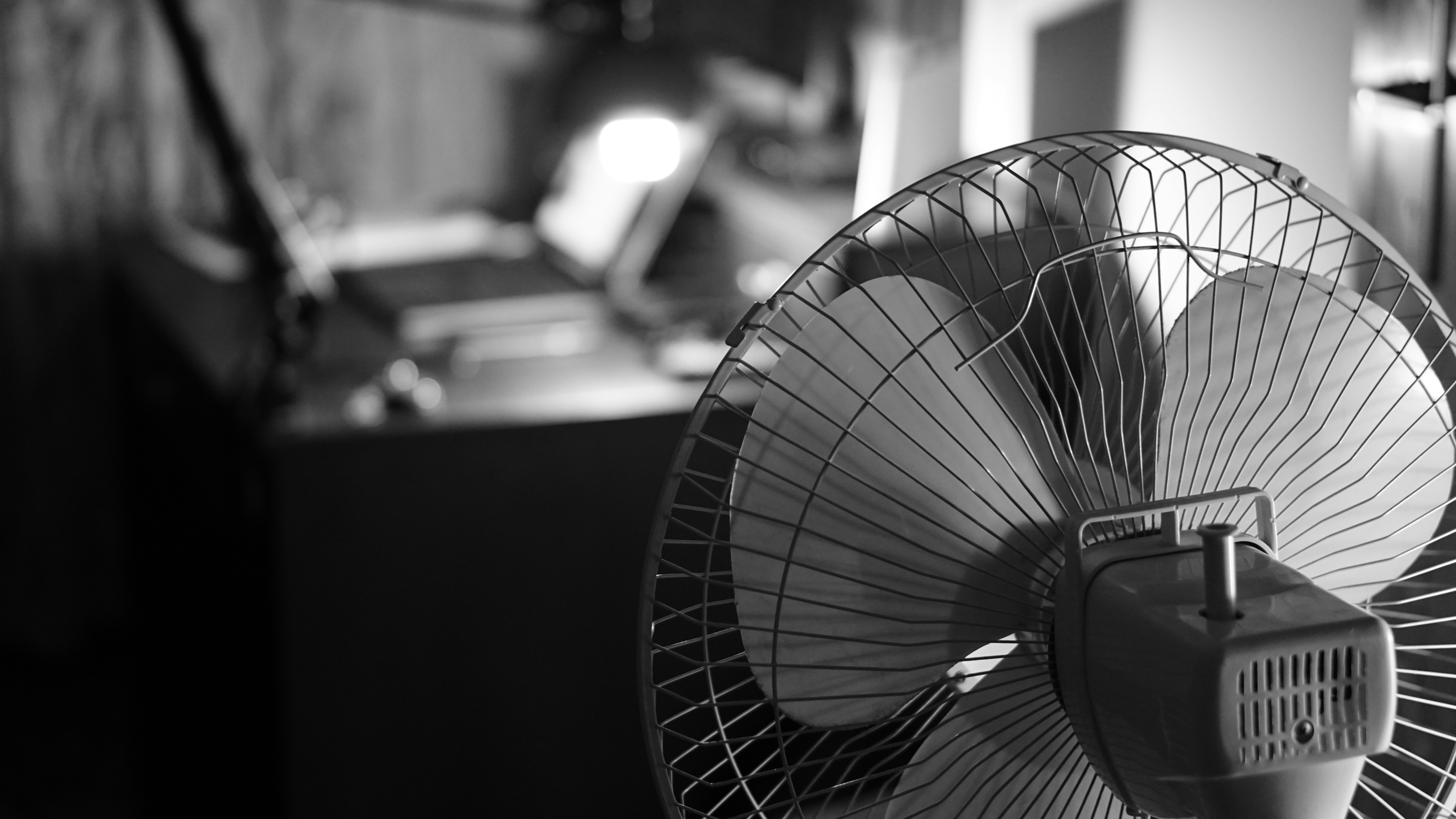 Fan cooling a person